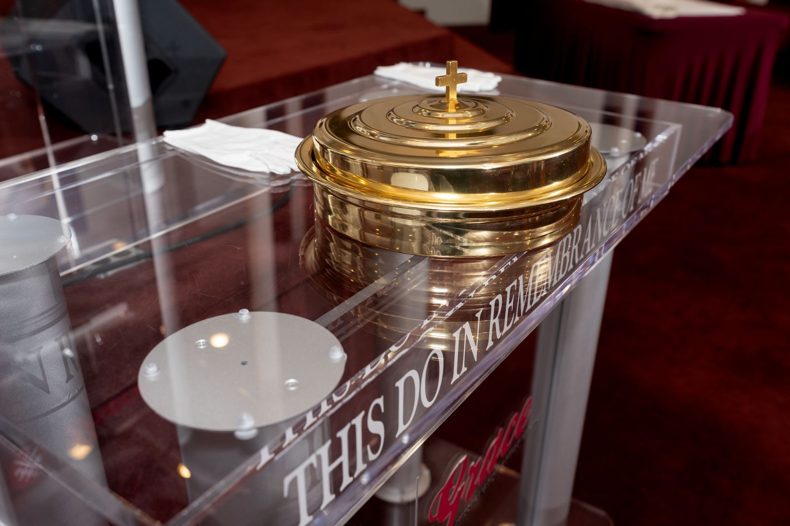 Communion trays on the Lord’s table, engraved ‘This do in remembrance of me’