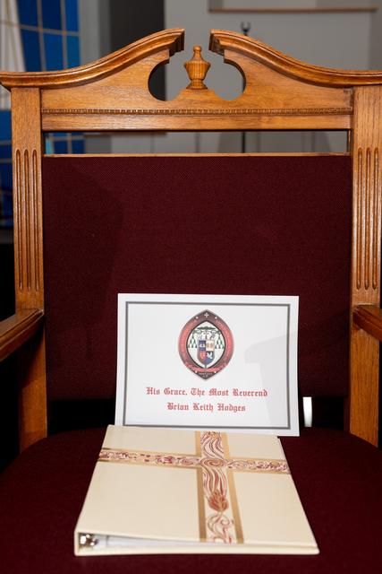 A chair set with a program for one of the visiting bishops