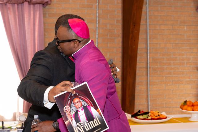 The Bishop-elect embracing a well-wisher