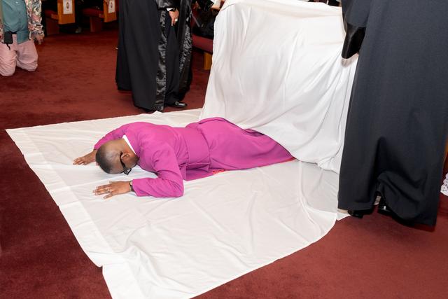 The Bishop-elect lying prostrate on a white cloth